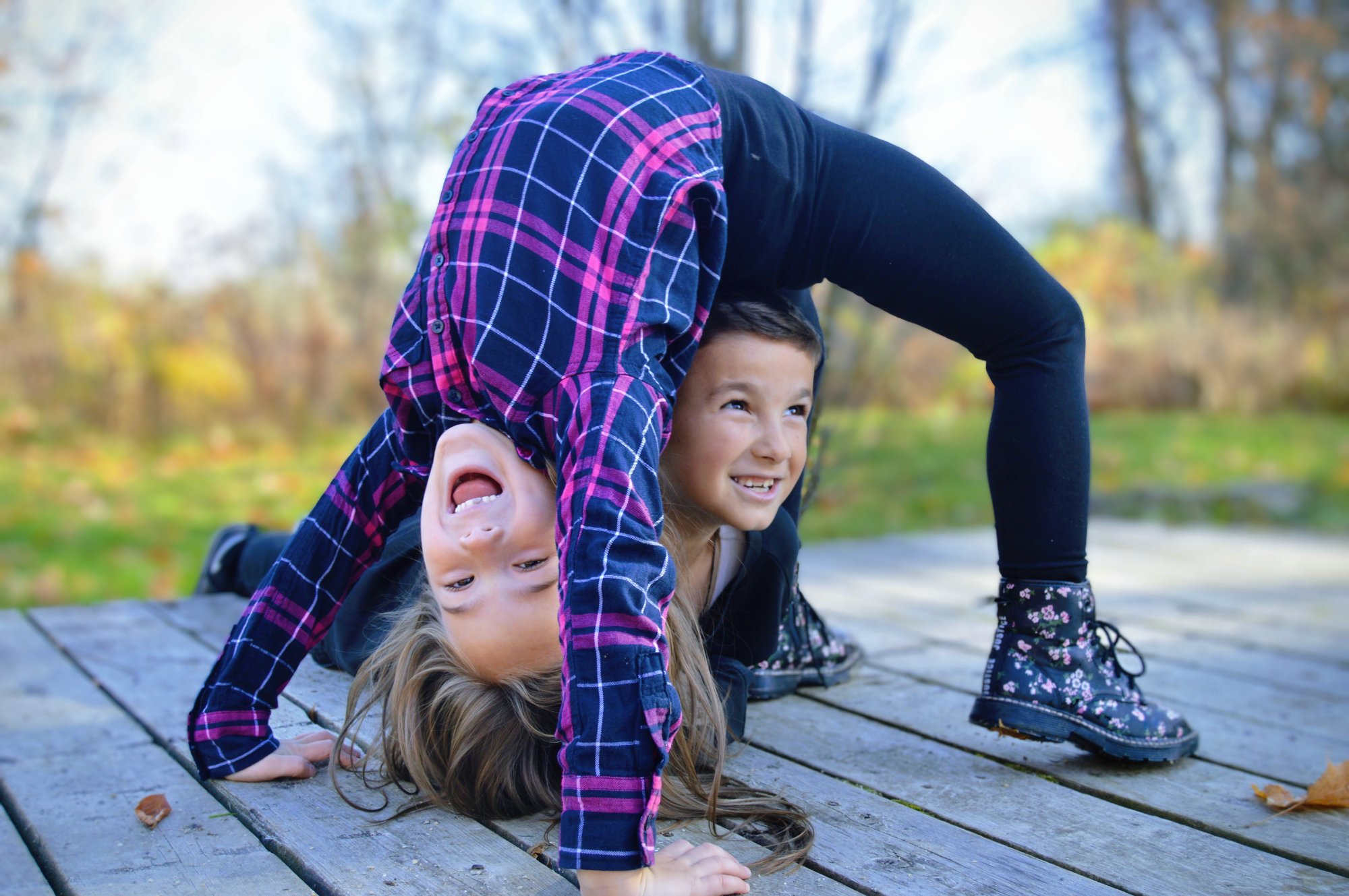 Kids playing and laughing on deck - lifestyle photography in Elmira, Ontario